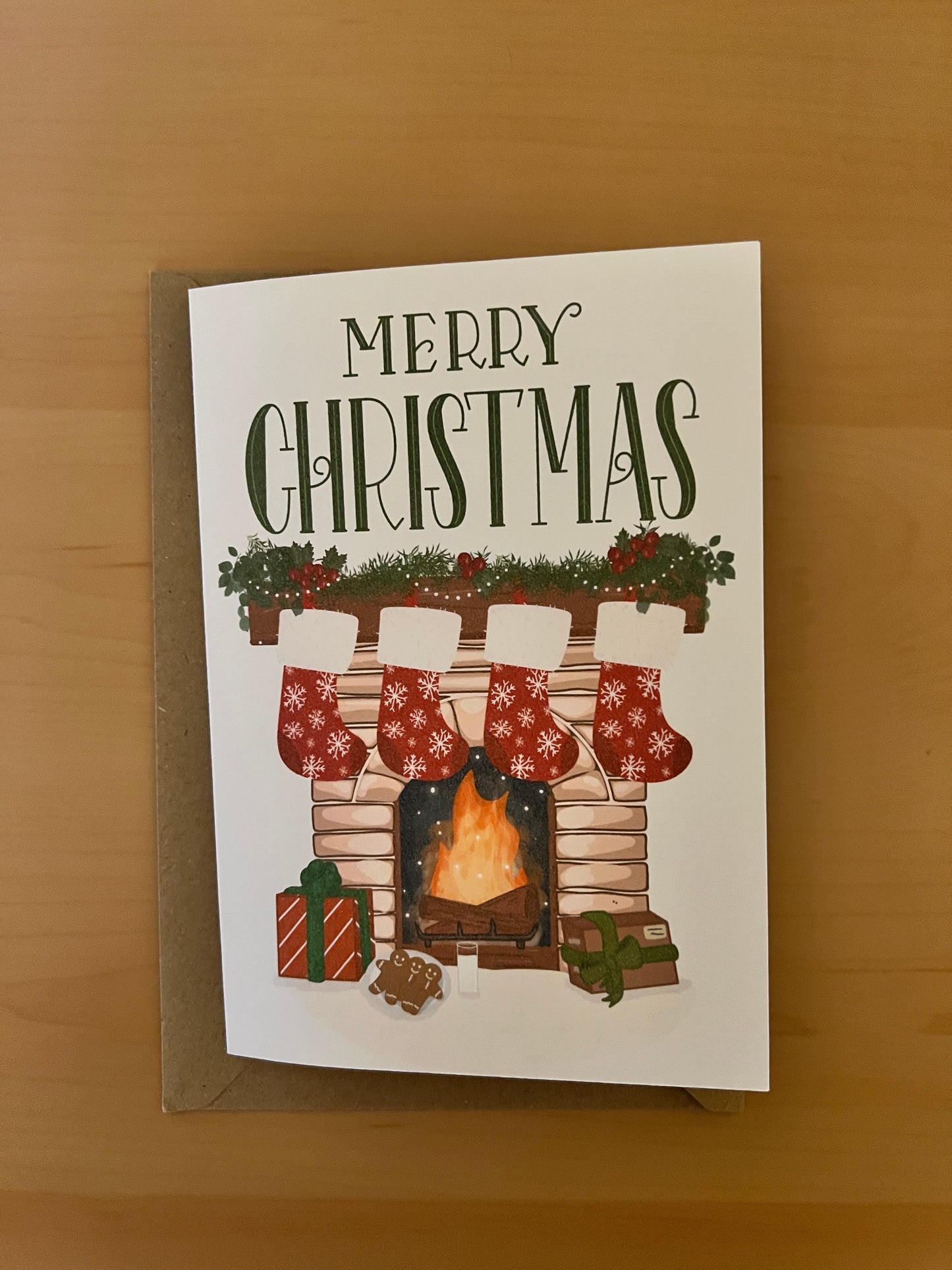 Cosy Fireplace Christmas Card – Festive Mantel with Stockings and Gifts