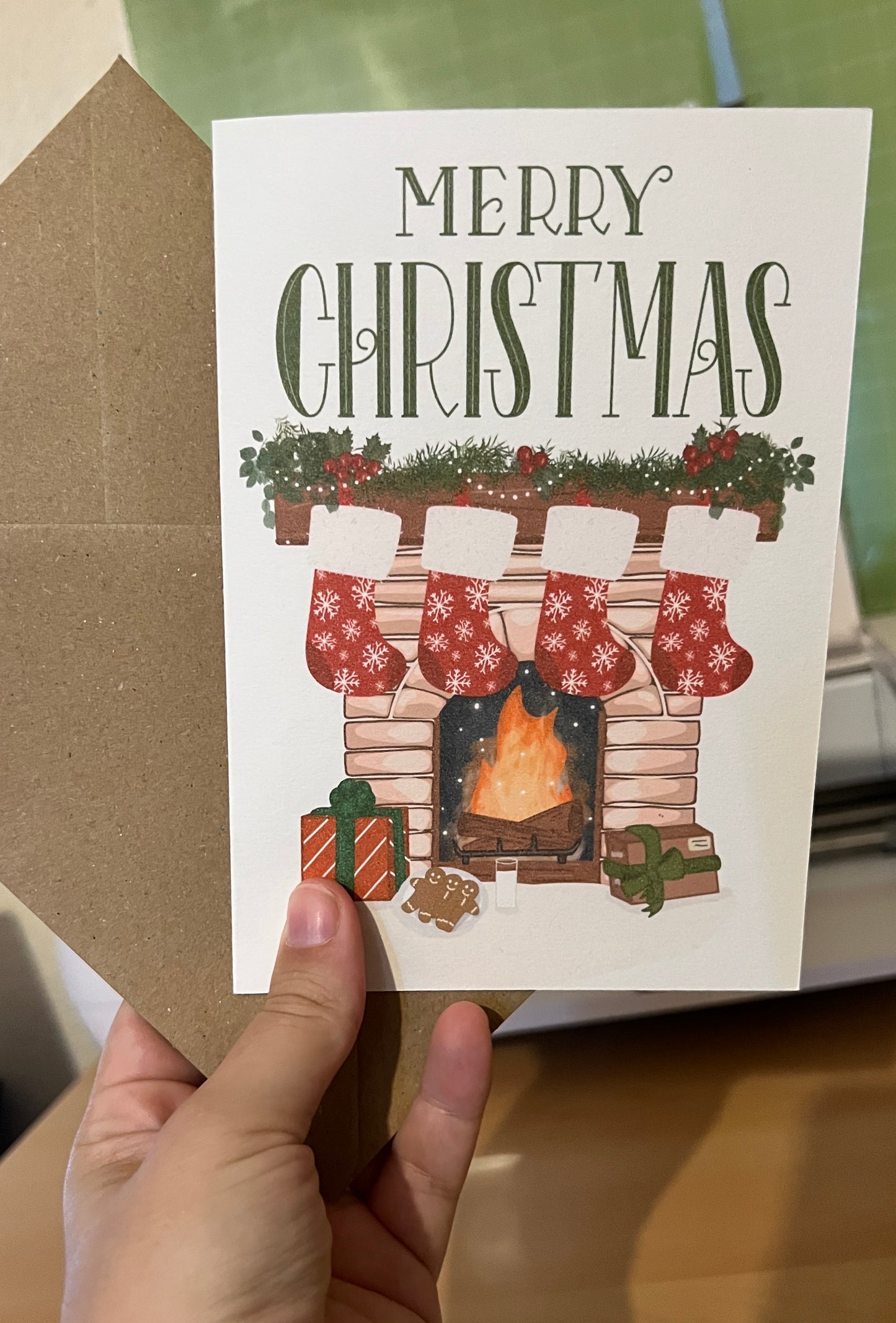 Cosy Fireplace Christmas Card – Festive Mantel with Stockings and Gifts