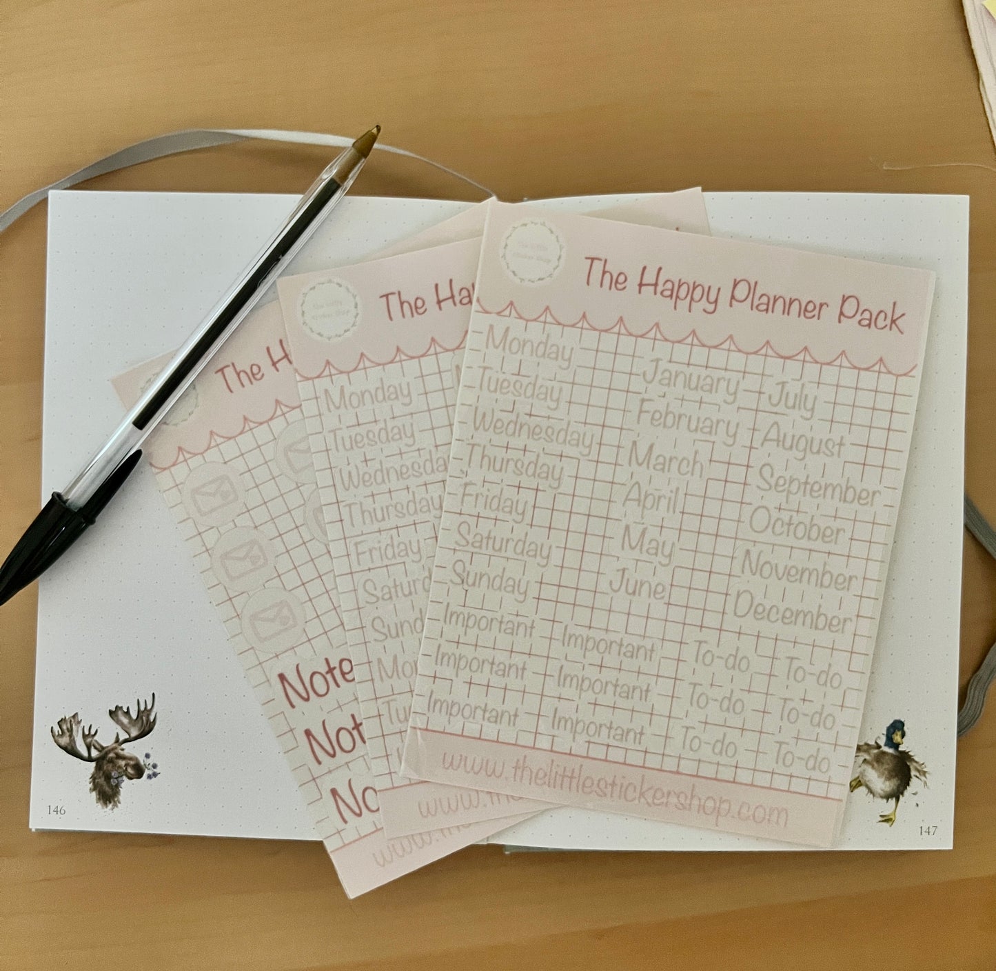 Happy Planner Pack sticker sheets pack of 3, displayed on a notebook on a wooden surface